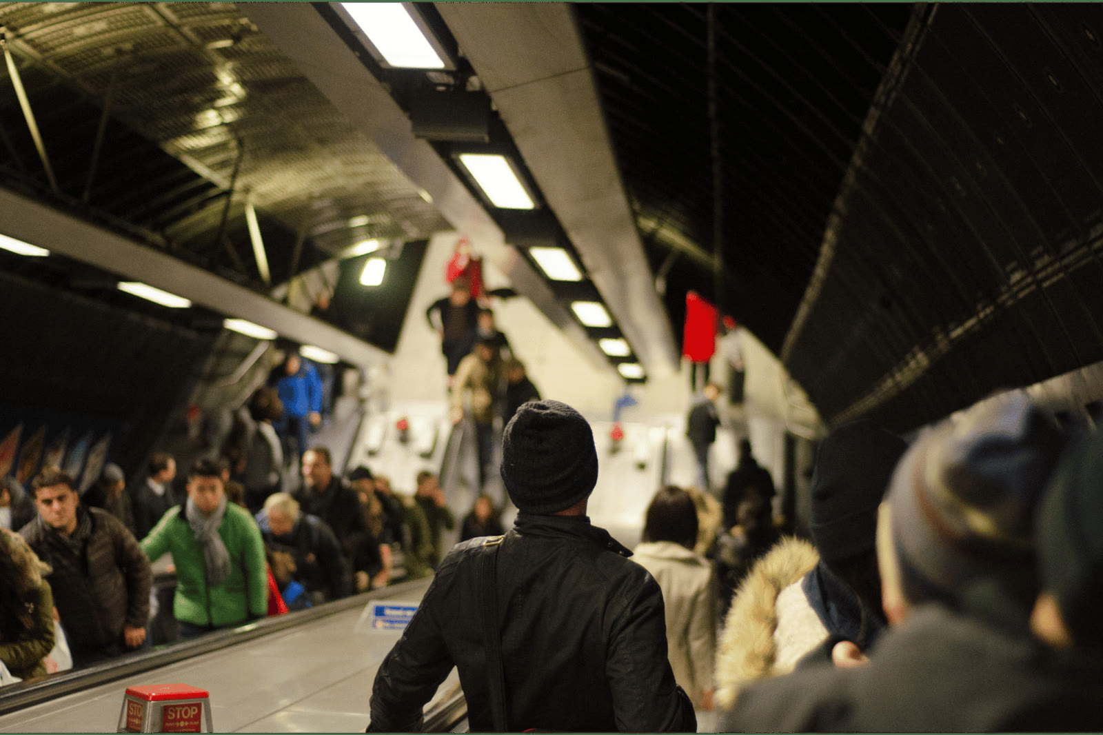 Commuters on a London Underground escalator